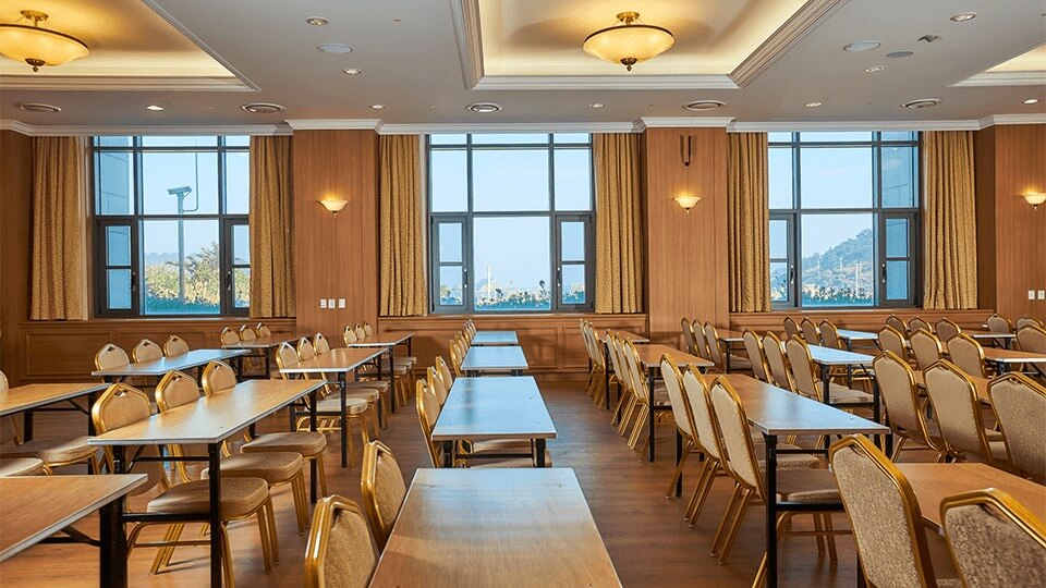 chairs, tables, and view from the window of Grand Ballroom facility