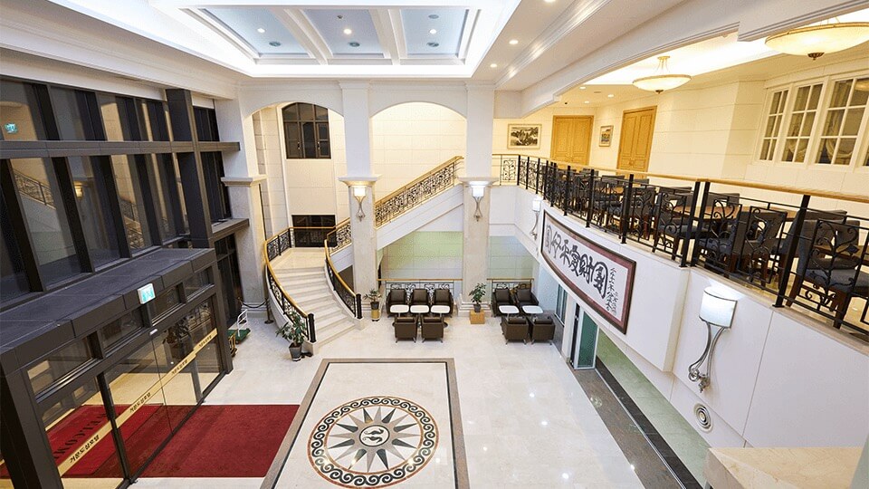 first and second floor of main lobby with tables and sofa