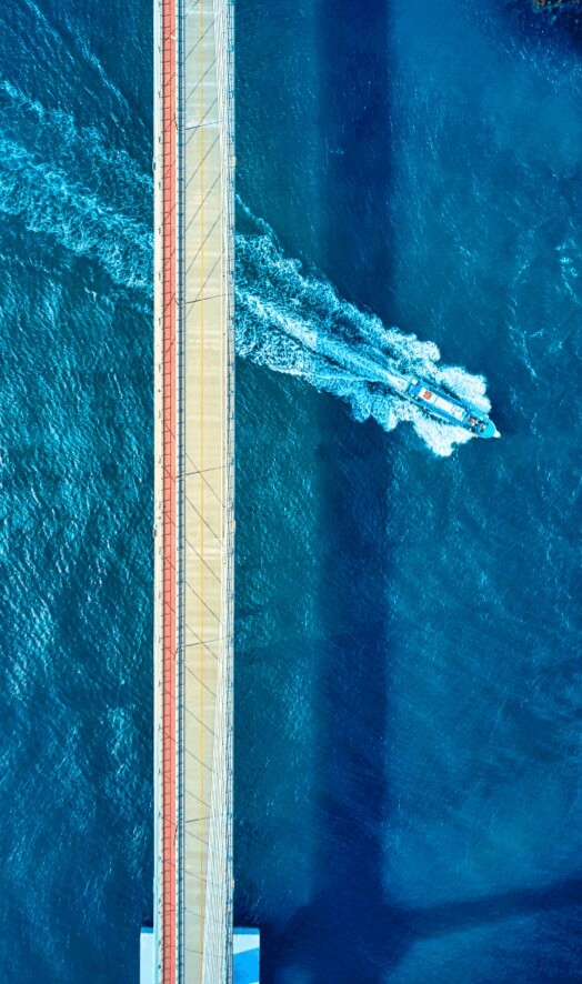 a boat crossing under the geomun bridge